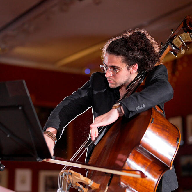 Untitled Close-up shot of Elias Kokkoris performing double bass, captured during filming for Camerata's "Making Place: 100 Views of Brisbane" exhibition at the Museum of Brisbane.